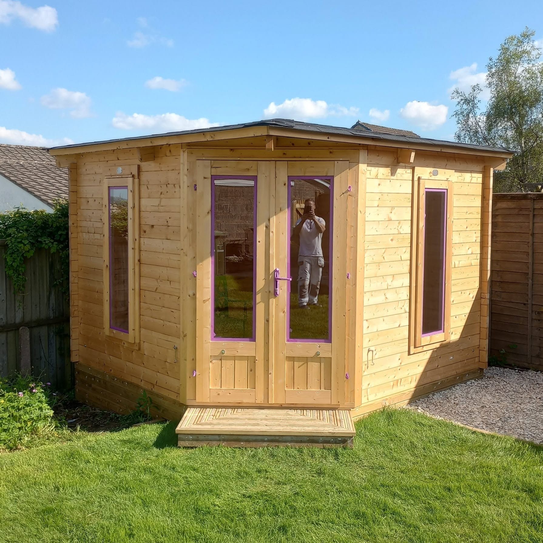 Corner summerhouse in bare timber before painting